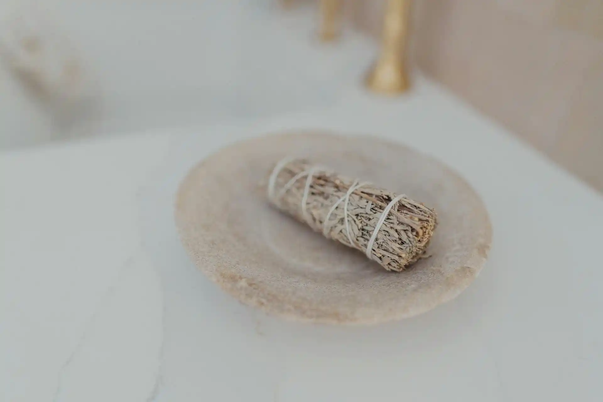 Bowl with incense sticks burning, representing holistic Ayurvedic practices in the 5-Day Digestive Reset.